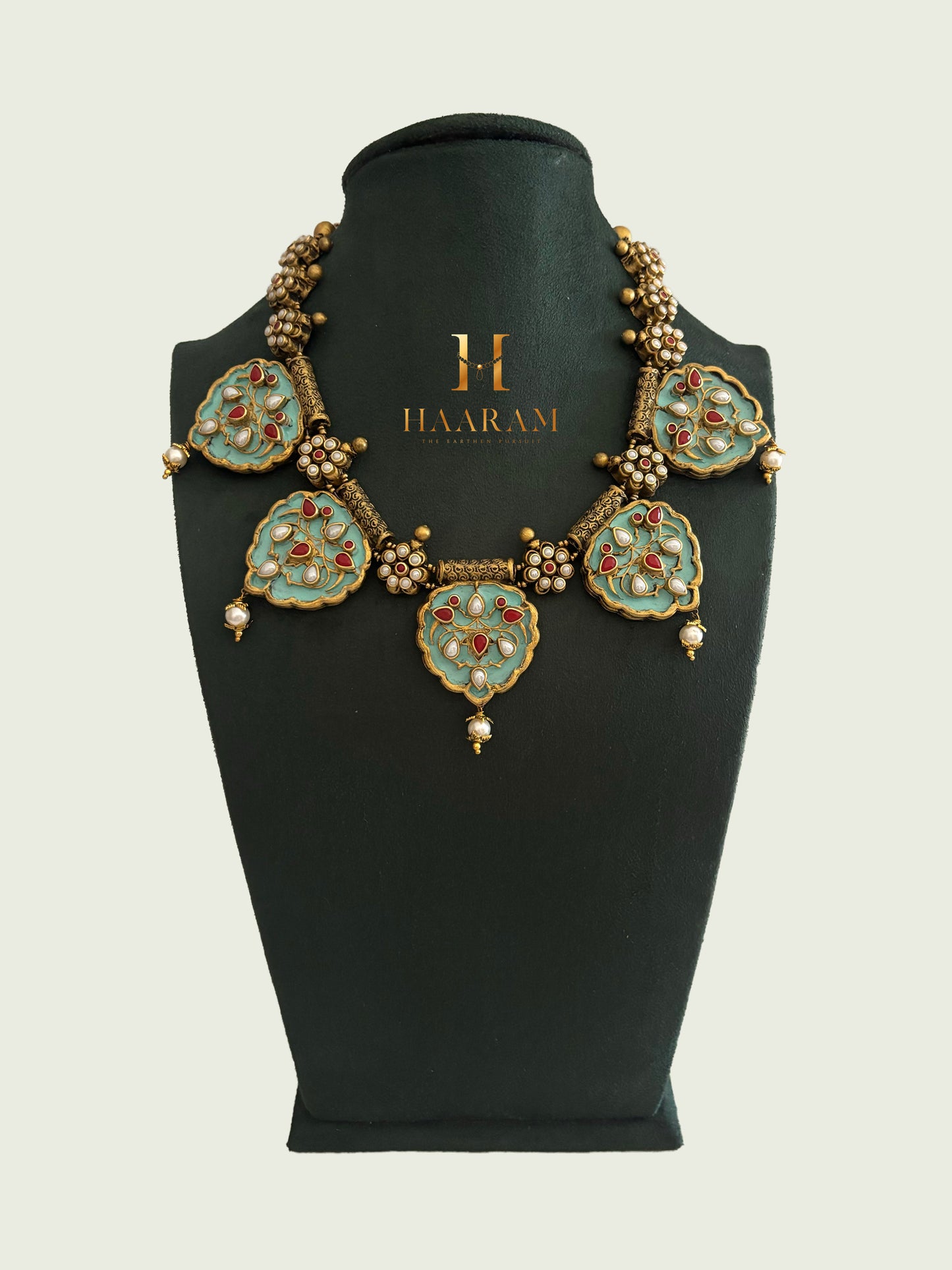 Handcrafted terracotta choker with floral detailing and gold beads by Haarambyyashh.