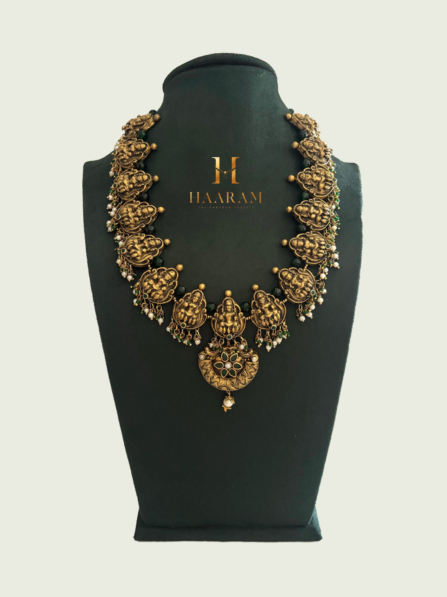 Antique gold terracotta necklace with goddess motifs and pearls by Haarambyyashh.