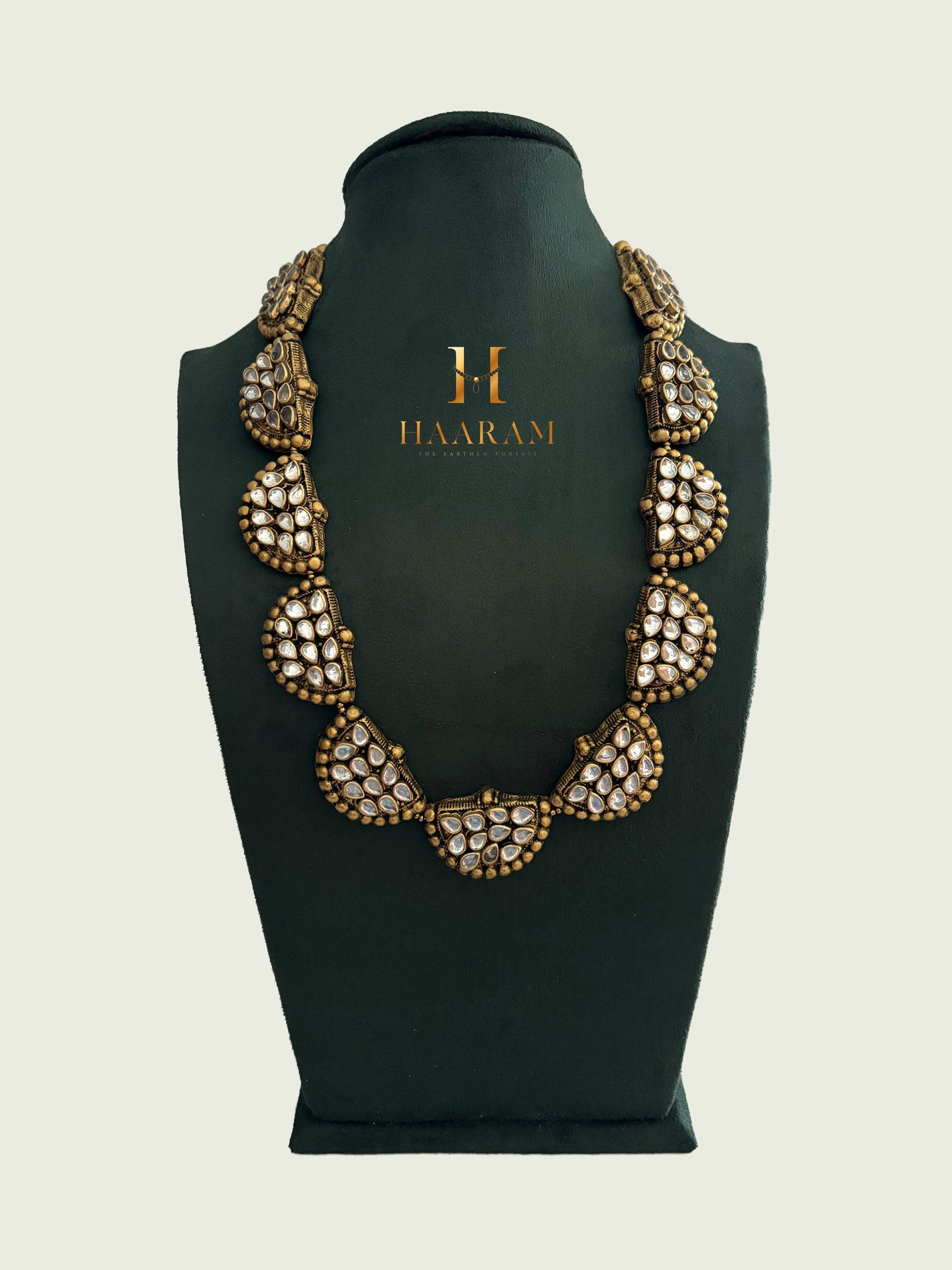 Handcrafted Kundan statement terracotta necklace in antique gold with white stones by HaarambyYashh