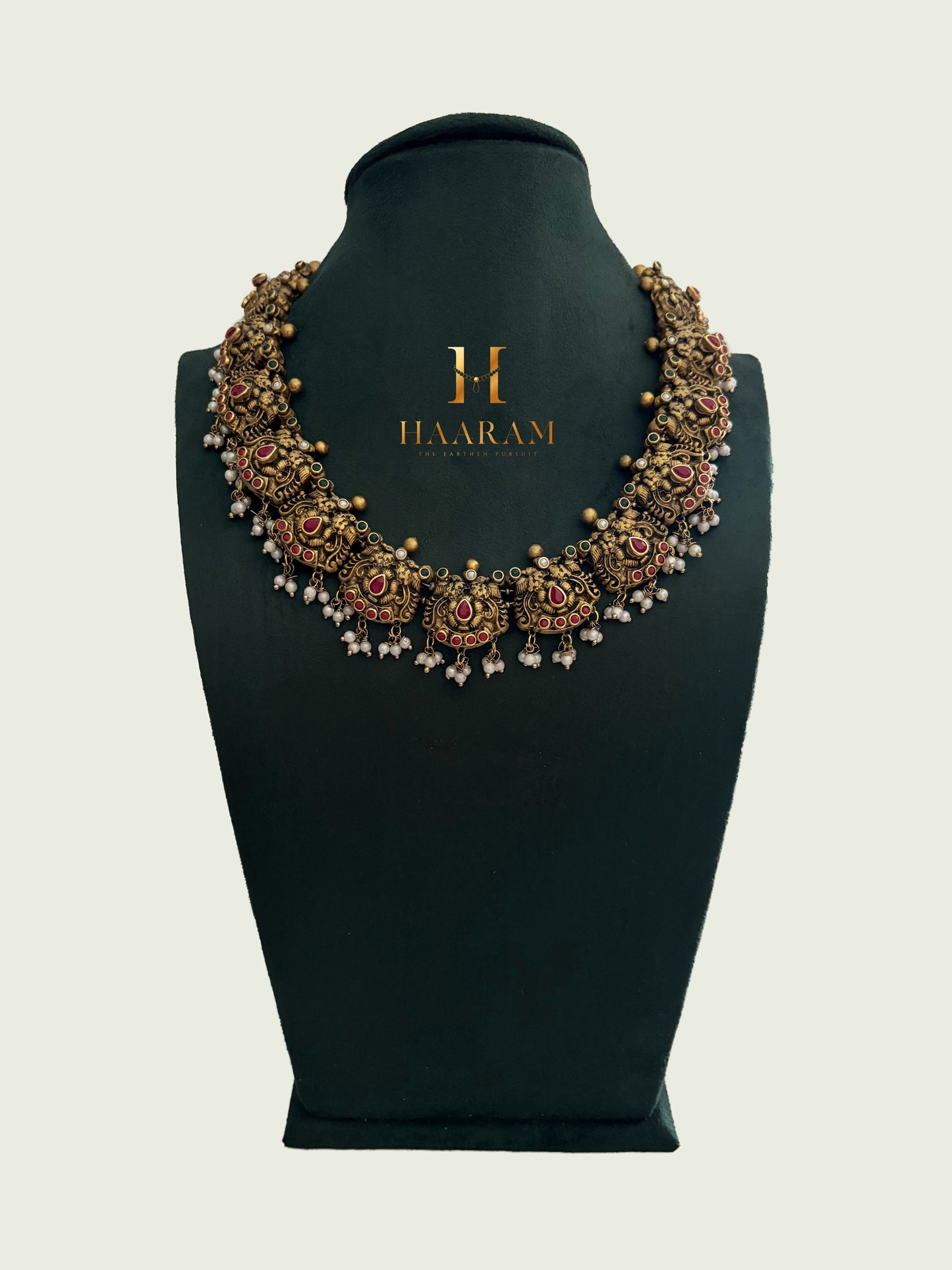 Handcrafted ruby floral temple terracotta necklace with antique gold finish by HaarambyYashh.