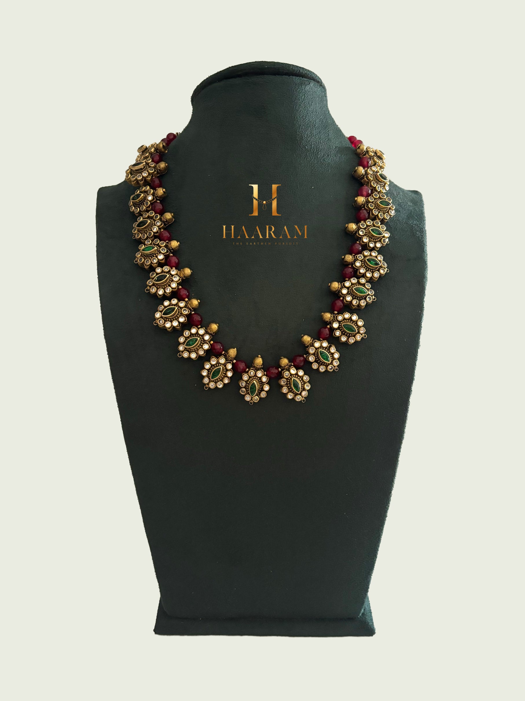 Kundan terracotta necklace with intricate detailing and vibrant beads by Haarambyyashh.