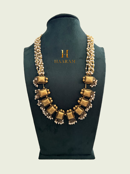 Handcrafted terracotta necklace with gold-tone rectangular pendants, multi-strand pearl chain, and intricate bead-work from Haarambyyashh 