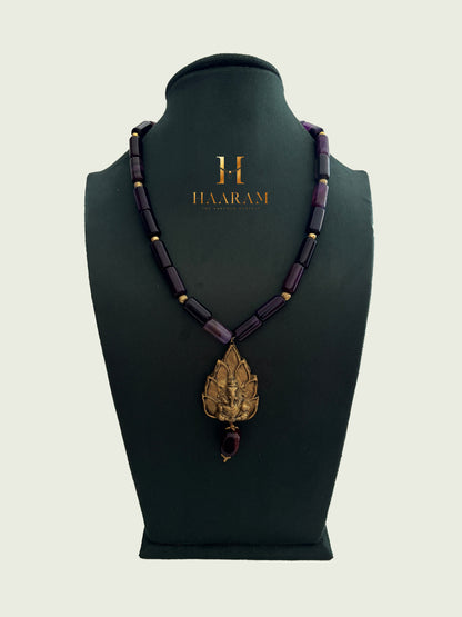 Necklace with Navy beads and a leaf terracotta pendant by haarambyyashh