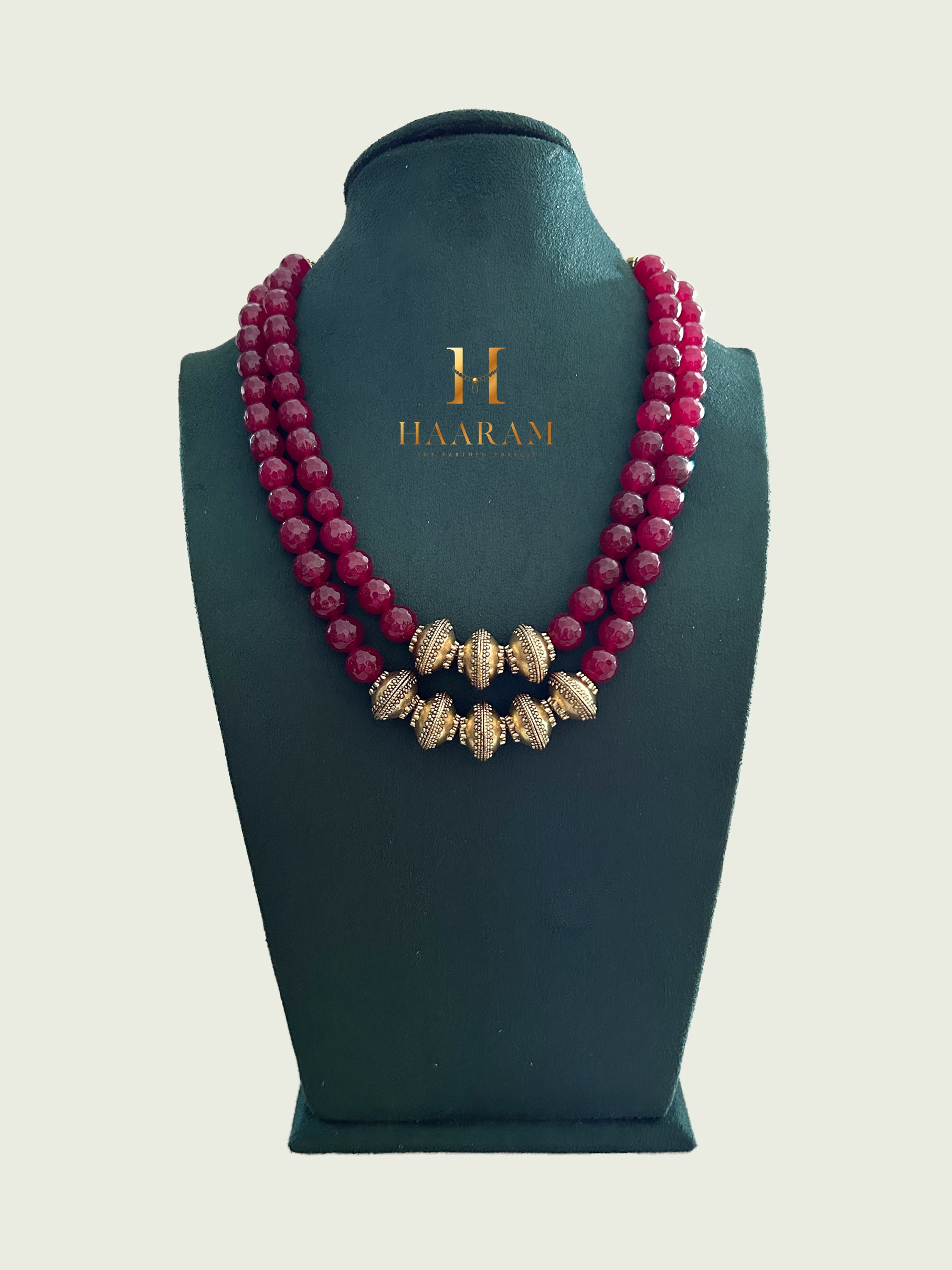 Handcrafted terracotta necklace with double-layer crimson beads and gold-toned accents from HaarambyYashh.