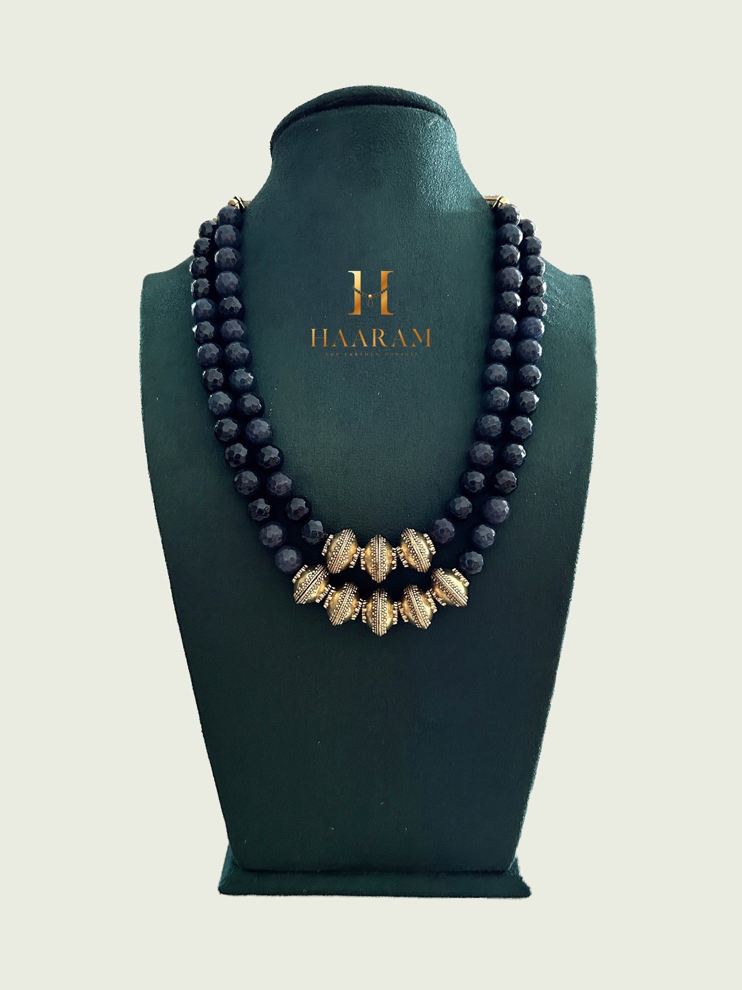 Handcrafted terracotta necklace with double-layer crimson beads and gold-toned accents from HaarambyYashh.