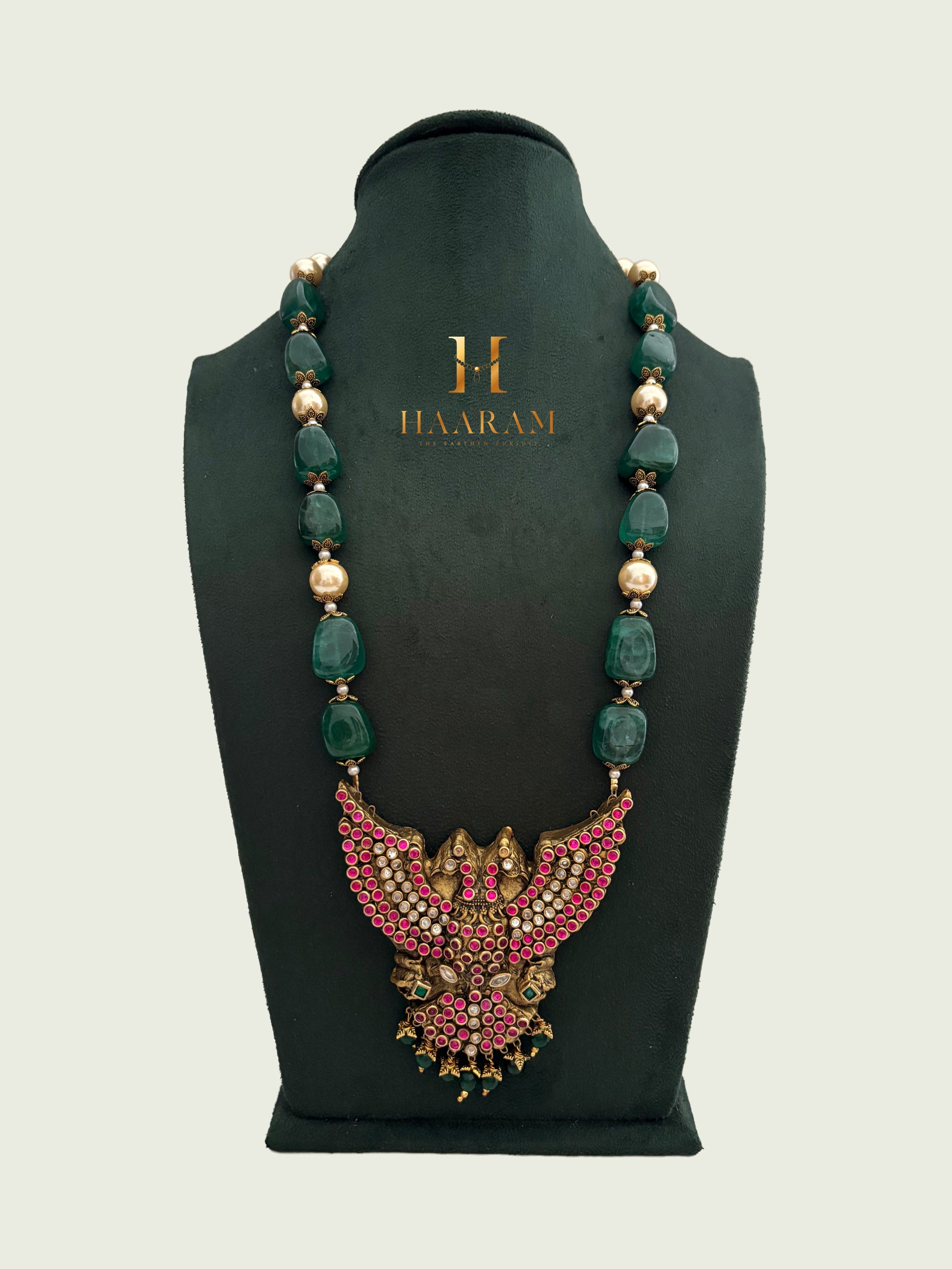 Terracotta necklace with green beads and peacock design pendant